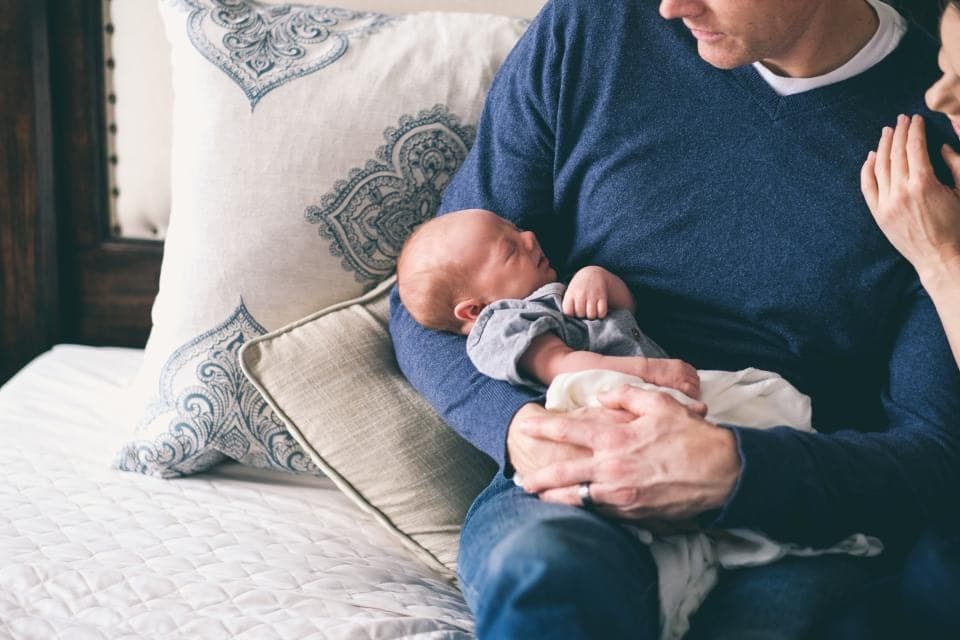 A father holding his newborn