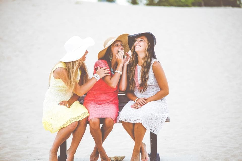 Three friends laughing together